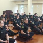 Canadian Police Officers Practice Meditation in Buddhist Temple as Part of Training